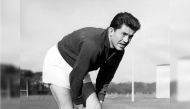 (FILES) In preparation for their match against England at Twickenham, French rugby union player Lucien Mias, captain of the French Rugby union team, puts a bandage over his injured knee during a fitness test on February 27, 1959 at Athletic Ground of Richmond, Greater London, United Kingdom. (Photo by AFP)
