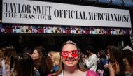 A fan of US singer and songwriter Taylor Alison Swift, also known as Taylor Swift, stands in a queue to attend the concert at the Paris La Defense Arena as part of her The Eras Tour, in Nanterre, north-western France, on May 10, 2024. (Photo by Dimitar DILKOFF / AFP)