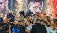 Britain's Tyson Fury (left) and Ukraine's Oleksandr Usyk (right) face-off during the official weigh-in on the eve of their heavyweight world boxing championship fight in Riyadh on May 17, 2024. (Photo by Yasser al-Umari / AFP)