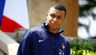 French forward Kylian Mbappe waits for the arrival of French President for a lunch at the team's training camp, as part of the team's preparation for the UEFA Euro 2024 European football championships in Clairefontaine-en-Yvelines on June 3, 2024. (Photo by Sarah Meyssonnier / POOL / AFP)