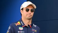 Red Bull Racing's Mexican driver Sergio Perez walks in the paddock ahead of the Formula One Monaco Grand Prix on May 26, 2024 at the Circuit de Monaco. (Photo by NICOLAS TUCAT / AFP)
