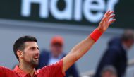 Serbia's Novak Djokovic celebrates after winning against Argentina's Francisco Cerundolo at the end of their men's singles round of sixteen match on Court Philippe-Chatrier on day nine of the French Open tennis tournament at the Roland Garros Complex in Paris on June 3, 2024. (Photo by Emmanuel Dunand / AFP)