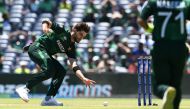 Pakistan's Shaheen Shah Afridi dives for the ball during the ICC men's Twenty20 World Cup 2024 group A cricket match between the USA and Pakistan at the Grand Prairie Cricket Stadium in Grand Prairie, Texas, on June 6, 2024. (Photo by Andrew Caballero-Reynolds / AFP) 