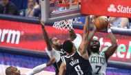 Jaylen Brown of the Boston Celtics shoots the ball against Josh Green of the Dallas Mavericks during the second quarter in Game Four of the 2024 NBA Finals at American Airlines Center on June 14, 2024 in Dallas, (Photo by Tim Heitman / GETTY IMAGES NORTH AMERICA / Getty Images via AFP)
