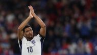 England's midfielder #10 Jude Bellingham greets the fans at the end of the UEFA Euro 2024 Group C football match between Serbia and England at the Arena AufSchalke in Gelsenkirchen on June 16, 2024. (Photo by Adrian DENNIS / AFP)
