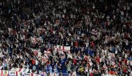 England fans celebrate at the end of the UEFA Euro 2024 Group C football match between Serbia and England at the Arena AufSchalke in Gelsenkirchen on June 16, 2024. (Photo by Ina Fassbender / AFP)