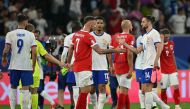 :France's midfielder #14 Adrien Rabiot (R) shakes hand with Austria's forward #07 Marko Arnautovic at the end of the UEFA Euro 2024 Group D football match between Austria and France at the Duesseldorf Arena in Duesseldorf on June 17, 2024. (Photo by OZAN KOSE / AFP)
