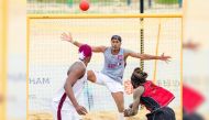 Qatar's goalkeeper Mohsen Mohammed Alyafeai attempts to stop a shot. 