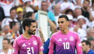 Germany's midfielder #21 Ilkay Gundogan (L) and Germany's midfielder #10 Jamal Musiala celebrate after winning the UEFA Euro 2024 Group A football match between Germany and Hungary at the Stuttgart Arena in Stuttgart on June 19, 2024. (Photo by DAMIEN MEYER / AFP)
