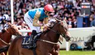 Jockey James Doyle guides Leovanni towards the finish line.