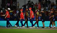 Players meet on the field after England won the ICC men's Twenty20 World Cup 2024 Super Eight cricket match against West Indies on June 19, 2024. (Photo by Chandan Khanna / AFP)