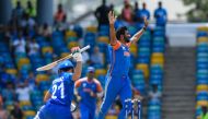 India's Jasprit Bumrah celebrates the dismissal of Afghanistan's Rahmanullah Gurbaz (left) during the ICC men's Twenty20 World Cup 2024 Super Eight cricket match between Afghanistan and India at Kensington Oval in Bridgetown, Barbados, on June 20, 2024. (Photo by Randy Brooks / AFP)