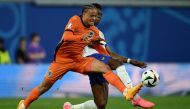 France's midfielder #08 Aurelien Tchouameni (Rear) and Netherlands' forward #07 Xavi Simons fight for the ball during the UEFA Euro 2024 Group D football match between the Netherlands and France at the Leipzig Stadium in Leipzig on June 21, 2024. (Photo by Christophe Simon / AFP)