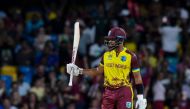 West Indies' Shai Hope celebrates after scoring a half-century (50 runs) during the ICC men's Twenty20 World Cup 2024 Super Eight cricket match on June 21, 2024. (Photo by Randy Brooks / AFP)