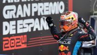 Red Bull's Dutch driver Max Verstappen celebrates winning the Spanish Formula One Grand Prix at the Circuit de Catalunya on June 23, 2024 in Montmelo, on the outskirts of Barcelona. (Photo by Thomas COEX / AFP)
