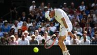 FILES: Britain's Andy Murray reacts as he plays against Greece's Stefanos Tsitsipas during their men's singles tennis match on the fifth day of the 2023 Wimbledon Championships at The All England Tennis Club in Wimbledon, southwest London, on July 7, 2023. (Photo by SEBASTIEN BOZON / AFP)