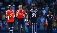 England's captain and wicketkeeper Jos Buttler (C) goes to shake hands with USA's Shadley Van Schalkwyk after England won the ICC men's Twenty20 World Cup 2024 Super Eight cricket match between USA and England at Kensington Oval in Bridgetown, Barbados on June 23, 2024. (Photo by Chandan Khanna / AFP)
