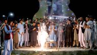 Afghan fans burst firecrackers in Khost on June 23, 2024 to celebrate Afghanistan's win against Australia at their ICC men's Twenty20 World Cup 2024 Super Eight cricket match. (Photo by AFP)