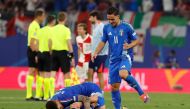 Italy's forward #20 Mattia Zaccagni (down) celebrates with teammates at the end of the UEFA Euro 2024 Group B football match between Croatia and Italy at the Leipzig Stadium in Leipzig on June 24, 2024. (Photo by Odd ANDERSEN / AFP)
