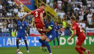 France's forward #10 Kylian Mbappe, wearing a protective mask, fights for the ball with Poland's midfielder #03 Pawel Dawidowicz during the UEFA Euro 2024 Group D football match between France and Poland at the BVB Stadion in Dortmund on June 25, 2024. (Photo by Ozan Kose / AFP)