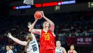 The photo taken on June 25, 2024 shows Chinese basketball player Zhang Ziyu (C) shooting past New Zealand's Elise Jayne Carline during their 2024 FIBA Under-18 Women's Asia Cup match in Shenzhen, in southern China's Guangdong province. (Photo by AFP) 