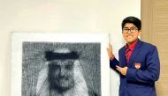 Dhyan Sreejith with his string art portrait of HH the Amir