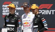 (L-R) Second placed McLaren's Australian driver Oscar Piastri, winner Red Bull Racing's Dutch driver Max Verstappen and third placed McLaren's British driver Lando Norris in Spielberg, Austria, on June 29, 2024. (Photo by Erwin Scheriau / APA / AFP)