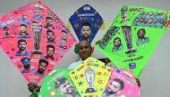 A kitemaker displays his kites decorated with pictures of Indian and South African cricket players in Amritsar on June 28, 2024, on the eve of the ICC men's Twenty20 World Cup 2024 final cricket match between India and South Africa. (Photo by Narinder NANU / AFP)
