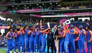 :Team India celebrates with the trophy after winning the ICC men's Twenty20 World Cup 2024 final cricket match between India and South Africa at Kensington Oval in Bridgetown, Barbados, on June 29, 2024. (Photo by CHANDAN KHANNA / AFP)
