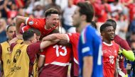 Switzerland's midfielder #17 Ruben Vargas (Top L), Switzerland's forward #18 Kwadwo Duah (R) celebrate at the end of the UEFA Euro 2024 round of 16 football match between Switzerland and Italy at the Olympiastadion Berlin in Berlin on June 29, 2024. (Photo by Fabrice COFFRINI / AFP)
