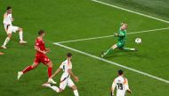 Germany’s Jamal Musiala (left) scores his team’s second goal past Denmark’s goalkeeper Kasper Schmeichel. AFP