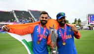 India's Virat Kohli and captain Rohit Sharma celebrate with the trophy on June 29, 2024. (Photo by Chandan Khanna / AFP)
 