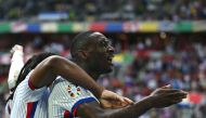 France's forward #12 Randal Kolo Muani (R) celebrates scoring his team's first goal during the UEFA Euro 2024 round of 16 football match between France and Belgium at the Duesseldorf Arena in Duesseldorf on July 1, 2024. (Photo by OZAN KOSE / AFP)
