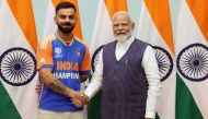 In this handout photograph taken and released on July 4, 2024 by the Indian Press Information Bureau (PIB), India's Prime Minister Narendra Modi shakes hands with Indian cricketer Virat Kohli in New Delhi, after India won the ICC men's Twenty20 World Cup 2024 in Barbados. (Photo by PIB / AFP)