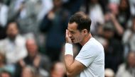 Britain's Andy Murray cries as he delivers a speech at the end of his men's doubles tennis match with his brother Britain's Jamie Murray, during a farewell ceremony to celebrate his last Wimbledon, on the fourth day of the 2024 Wimbledon Championships at The All England Lawn Tennis and Croquet Club in Wimbledon, southwest London, on July 4, 2024. (Photo by Ben Stansall / AFP) 
