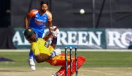 Zimbabwe's Clive Madande (front) ducks under a bouncer ball delivered by India's Mukesh Kumar (back) during the first T20 international cricket match between Zimbabwe and India at Harare Sports Club in Harare on July 6, 2024. (Photo by Jekesai NJIKIZANA / AFP)