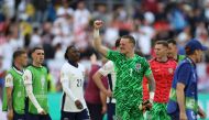 England's goalkeeper #01 Jordan Pickford celebrates after winning the UEFA Euro 2024 quarter-final football match between England and Switzerland at the Duesseldorf Arena in Duesseldorf on July 6, 2024. (Photo by Adrian DENNIS / AFP)
