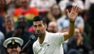 Winner Serbia's Novak Djokovic speaks during an interview and reacts to the cheering of the crowd at the end of his men's singles tennis match on July 8, 2024. (Photo by Ben Stansall / AFP) 