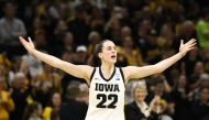 Guard Caitlin Clark #22 of the Iowa Hawkeyes celebrates after drawing a foul late in the second half against the West Virginia Mountaineers during their second round match-up in the 2024 NCAA Division 1 Women's Basketball Championship at Carver-Hawkeye Arena on March 25, 2024 in Iowa City, Iowa. (Photo by Matthew Holst / GETTY IMAGES NORTH AMERICA / Getty Images via AFP)

