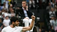 Spain's Carlos Alcaraz celebrates winning against USA's Tommy Paul during their men's singles quarter-finals tennis match on the ninth day of the 2024 Wimbledon Championships at The All England Lawn Tennis and Croquet Club in Wimbledon, southwest London, on July 9, 2024. (Photo by Ben Stansall / AFP)
