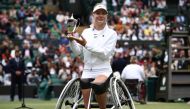 Netherlands' Diede De Groot poses with the winner's trophy in Wimbledon, southwest London, on July 13, 2024. (Photo by Henry Nicholls / AFP) 