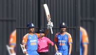 India's Yashasvi Jaiswal (L) celebrates after scoring a half century (50 runs) during the fourth T20 International cricket match between Zimbabwe and India at Harare Sports Club in Harare on July 13, 2024. (Photo by Jekesai NJIKIZANA / AFP)
