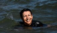 Paris Mayor Anne Hidalgo swims in the Seine, in Paris on July 17, 2024, to demonstrate that the river is clean enough to host the outdoor swimming events at the Paris Olympics later this month. Photo by JULIEN DE ROSA / AFP