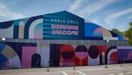 This photograph shows the entrance of the athletes' village for the Paris 2024 Olympics and Paralympics game, in Saint-Denis, north of Paris, on July 18, 2024. (Photo by Geoffroy VAN DER HASSELT / AFP)