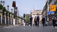 Police officers patrol along the Rivoli street ahead of the Paris 2024 Olympic and Paralympic Games, in Paris on July 20, 2024. (Photo by Kirill Kudryavtsev / AFP)