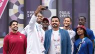 Qatar Olympic Committee President H E Sheikh Joaan bin Hamad Al Thani with Team Qatar athletes during his visit to the Olympic Village, in Paris, yesterday.