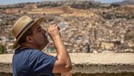 A man drinks water during during a heatwave in the city of Fez in Morocco on July 26, 2024. (Photo by Fadel Senna / AFP)

