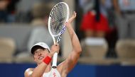 Poland's Iga Swiatek reacts after beating Romania's Irina-Camelia Begu in their women's singles first round tennis match on July 27, 2024. (Photo by Patricia De Melo Moreira / AFP)
 