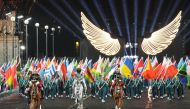 The horsewoman (C) arrive with the Olympic flag at the Trocadero Stadium during the opening ceremony of the Paris 2024 Olympic Games in Paris on July 26, 2024. (Photo by Xu Chang / POOL / AFP)
 