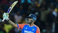 India's captain Suryakumar Yadav celebrates after scoring a half-century (50 runs) during the first Twenty20 international cricket match between Sri Lanka and India at the Pallekele International Cricket Stadium in Kandy on July 27, 2024. (Photo by Ishara S. KODIKARA / AFP)
